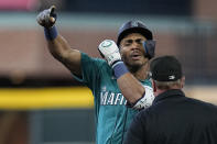 Seattle Mariners' Julio Rodriguez celebrates after hitting a leadoff double during the first inning of a baseball game against the Houston Astros, Sunday, Aug. 20, 2023, in Houston. (AP Photo/Kevin M. Cox)