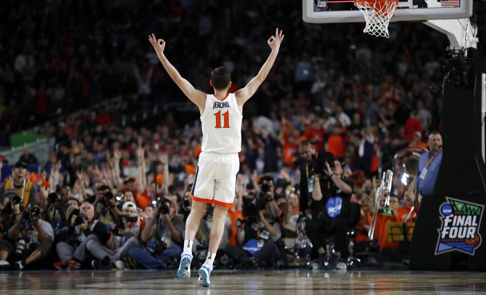 Virginia's Ty Jerome (11) reacts after shooting a 3-point basket during the first half in the championship of the Final Four NCAA college basketball tournament against Texas Tech, Monday, April 8, 2019, in Minneapolis. (AP Photo/Jeff Roberson)