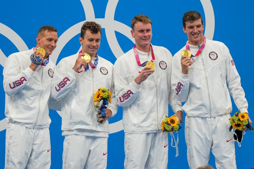 United States men's 4x100m freestyle relay team of Caeleb Dressel, Blake Pieroni, Bowen Becker and Zach Apple, celebrate with their medals after winning the gold medal at the 2020 Summer Olympics, Monday, July 26, 2021, in Tokyo, Japan.