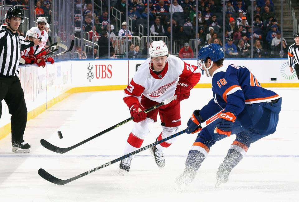Lucas Raymond of the Detroit Red Wings shoots the puck in against the New York Islanders during the first period at UBS Arena in Elmont, New York, on Saturday, March 4, 2023.