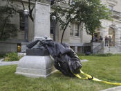 <p>A toppled Confederate statue lies on the ground on Monday, Aug. 14, 2017, in Durham, N.C. (Photo: Casey Toth/The Herald-Sun via AP) </p>