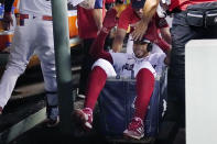 Boston Red Sox's Tommy Pham is congratulated after his solo home run during the third inning of a baseball game against the Atlanta Braves, Tuesday, Aug. 9, 2022, in Boston. (AP Photo/Charles Krupa)