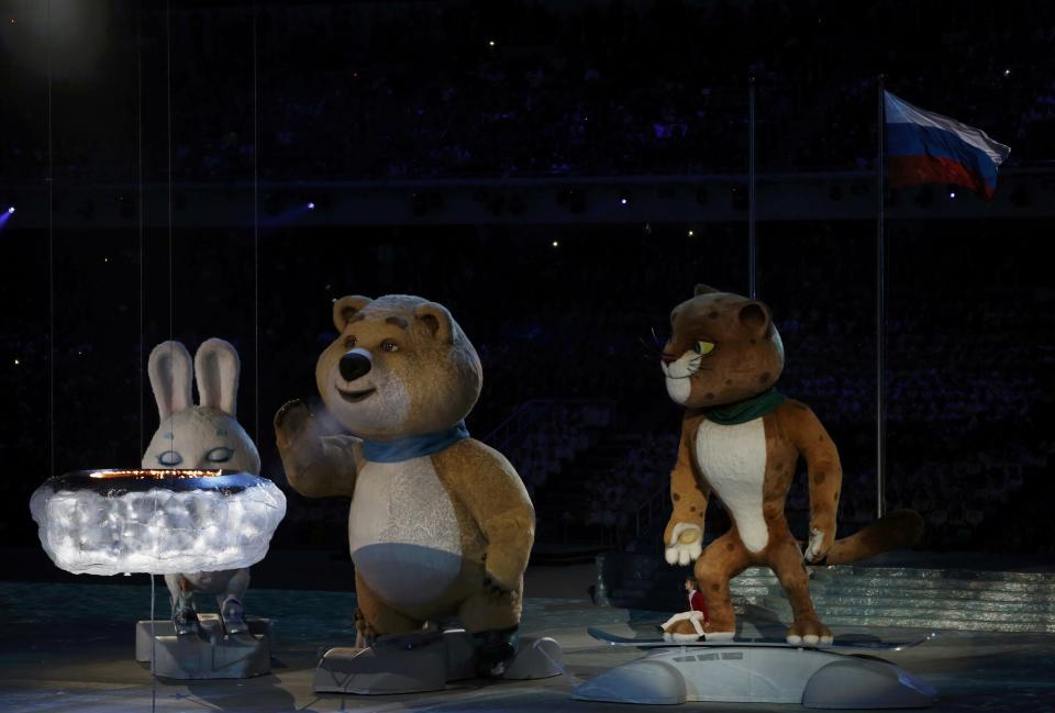 The Olympic mascots of a hare, a bear and a leopard (L-R) take part in the closing ceremony for the 2014 Sochi Winter Olympics, February 23, 2014. REUTERS/Gary Hershorn (RUSSIA - Tags: OLYMPICS SPORT)