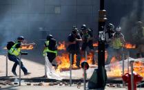 Protesters clash with police outside Hong Kong Polytechnic University (PolyU) in Hong Kong