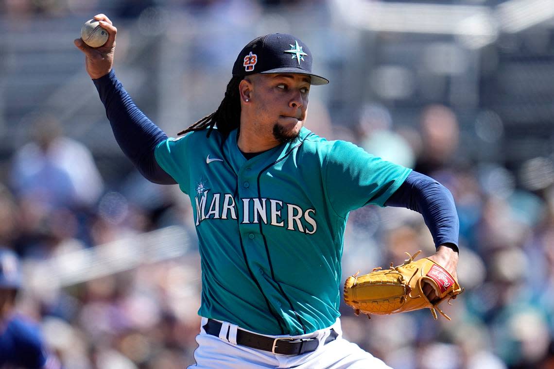 Seattle Mariners starting pitcher Luis Castillo delivers during the second inning of a spring training baseball game against the Texas Rangers, Sunday, March 12, 2023, in Peoria, Arizona.