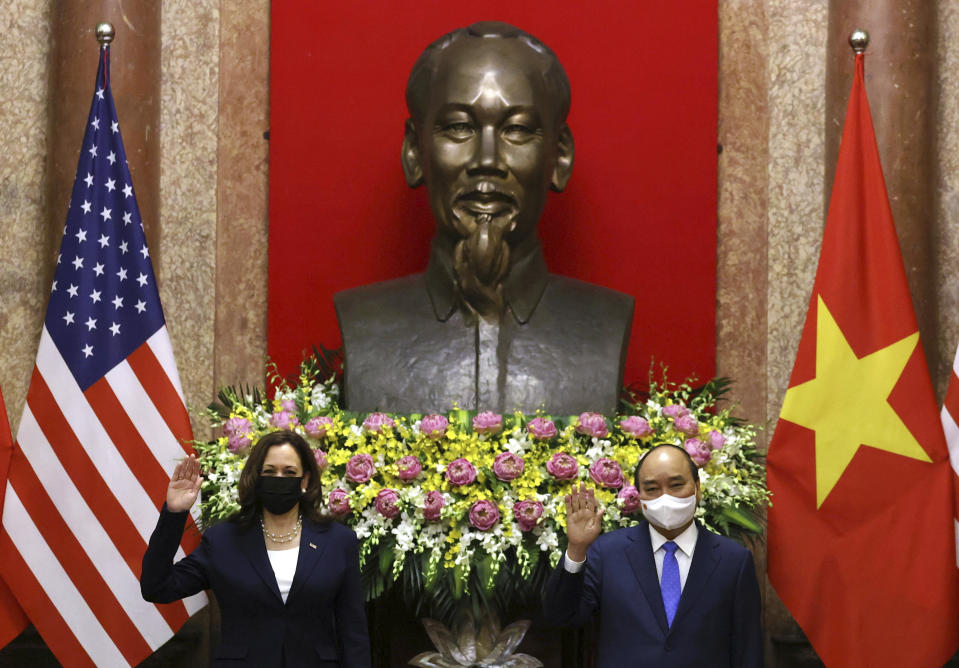 U.S. Vice President Kamala Harris, left, meets Vietnam's President Nguyen Xuan Phuc in the Presidential Palace in Hanoi, Vietnam, Wednesday, Aug. 25, 2021. (Evelyn Hockstein/Pool Photo via AP)