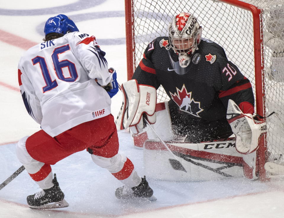 Canada's goaltender Joel Hofer makes the save on Czech Republic's Otakar Sik during the first period at the World Junior Hockey Championships on Tuesday, Dec. 31, 2019 in Ostrava, Czech Republic. (Ryan Remiorz/The Canadian Press via AP)