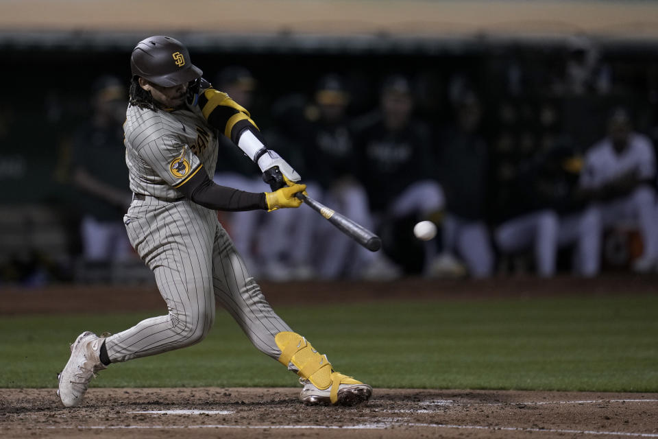 San Diego Padres' Luis Campusano hits an RBI double against the Oakland Athletics during the fifth inning of a baseball game Friday, Sept. 15, 2023, in Oakland, Calif. (AP Photo/Godofredo A. Vásquez)