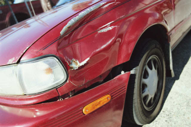 Car, close-up of damaged front fender