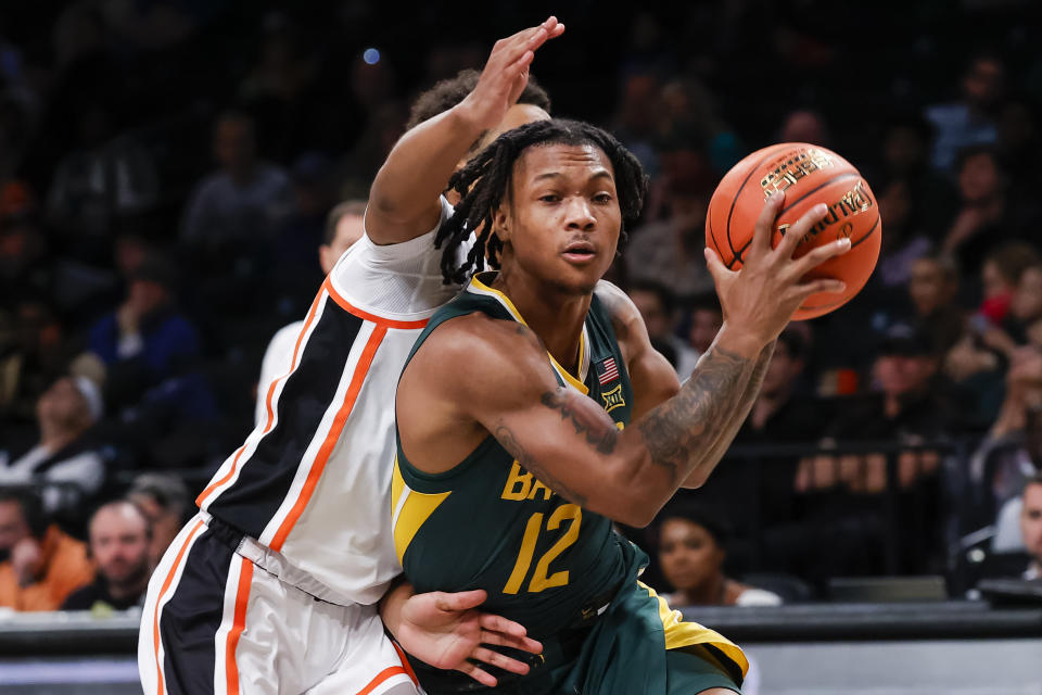 Baylor guard Dantwan Grimes (12) drives to the basket against Oregon State guard Josiah Lake II (2) during the second half of an NCAA college basketball game Wednesday, Nov. 22, 2023, in New York. (AP Photo/Eduardo Munoz Alvarez)