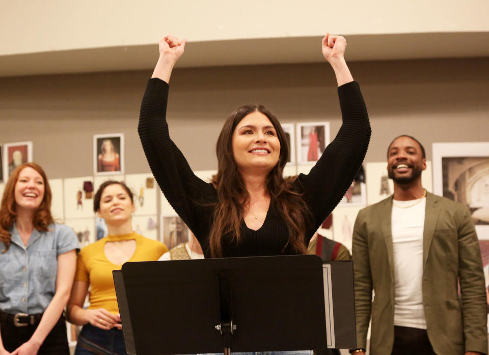 Closeup of Phillipa Soo with her hands raised