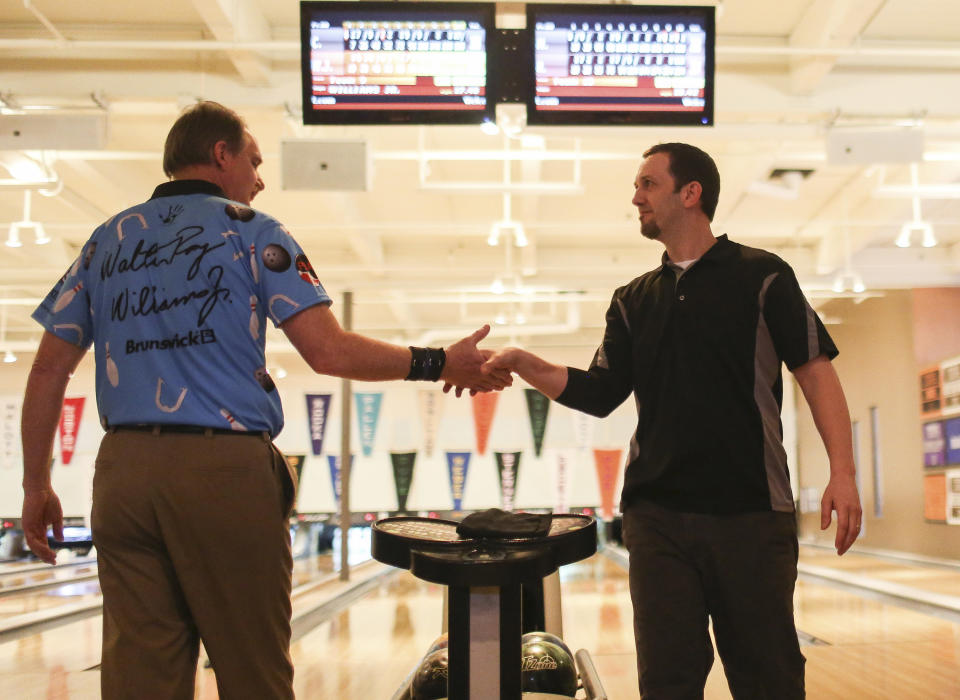 PORTLAND, ME - MARCH 30: Terrence Robinson of Gray shakes PBA player Walter Ray Williams Jr.'s hand after winning against the pro during the PBA Xtra Frame Maine Shootout at Bayside Bowling in Portland, ME on Monday, March 30, 2015. (Photo by Whitney Hayward/Portland Portland Press Herald via Getty Images)