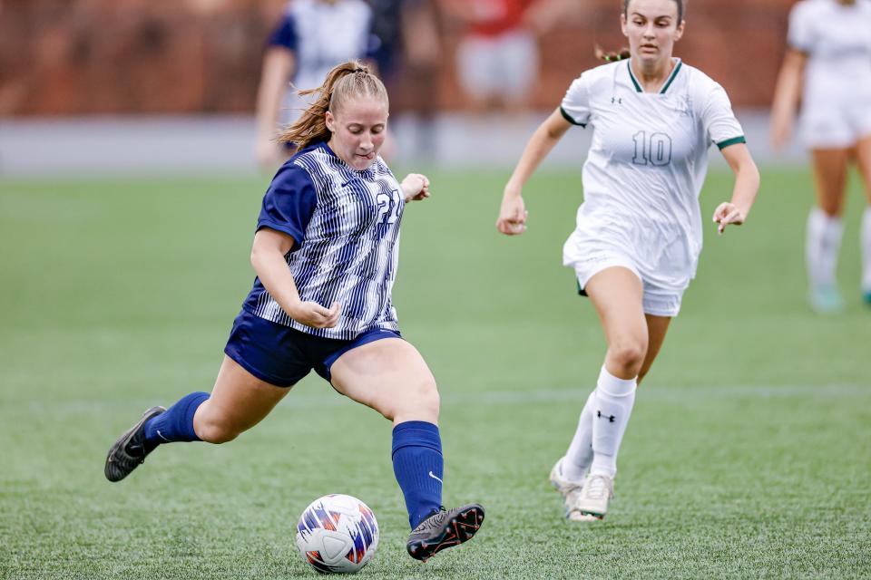 Edmond North's Julia McBride, 21, scores a goal during the Class 6A girls state championship soccer game between Edmond North and Norman North on Saturday, May 11, 2024, at Taft Stadium in Oklahoma City. Take a shot.