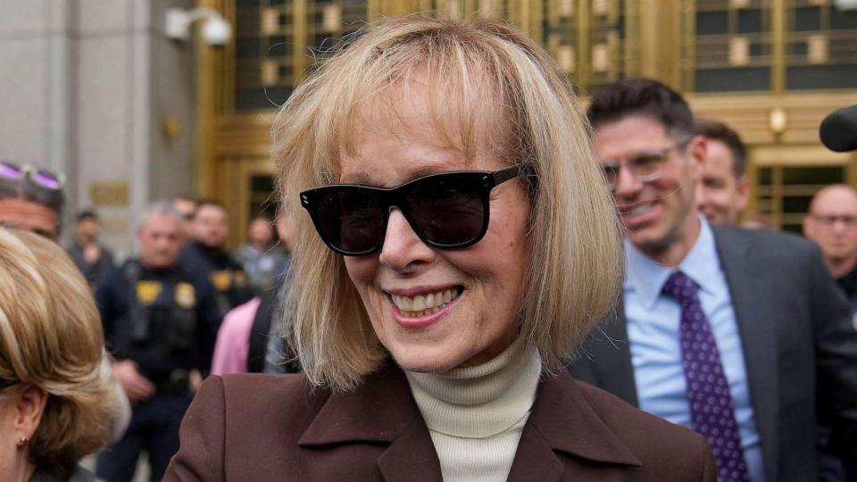 PHOTO: E. Jean Carroll, right, walks out of Manhattan federal court, May 9, 2023, in New York. (Seth Wenig/AP)