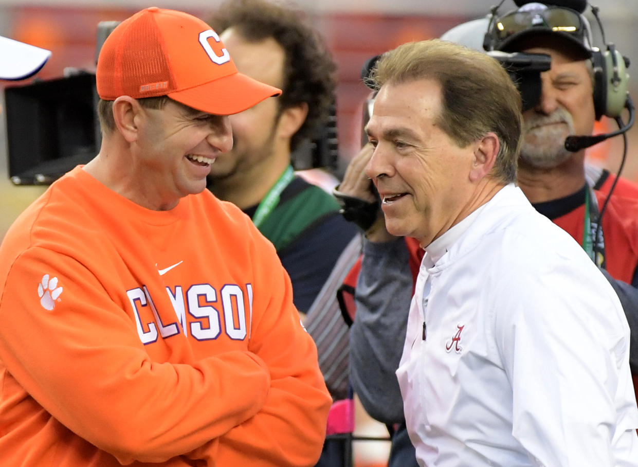Clemson Tigers coach Dabo Swinney (left) and Alabama Crimson Tide coach Nick Saban smile on the field before the 2019 CFP title game. (Kirby Lee-USA TODAY Sports)
