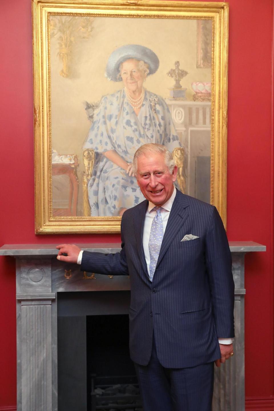 The Prince of Wales stands by a painting of The Queen Mother on Thursday (Getty Images)