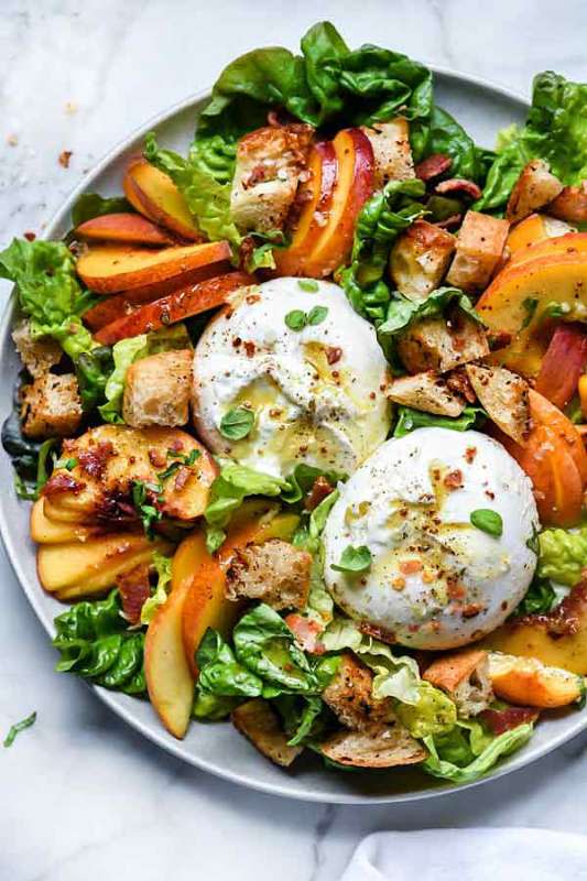 <p>Foodie Crush</p><p>This panzanella salad with sliced sweet peaches, savory bacon, and gooey burrata crunched with sourdough bread chunks and dressed in an easy to make golden balsamic vinegar dressing.</p><p><strong>Get the recipe: <a href="https://www.foodiecrush.com/peach-panzanella-salad-burrata-bacon/" rel="nofollow noopener" target="_blank" data-ylk="slk:Peach Panzanella Salad Burrata and Bacon;elm:context_link;itc:0;sec:content-canvas" class="link rapid-noclick-resp"><em>Peach Panzanella Salad Burrata and Bacon</em></a></strong></p>