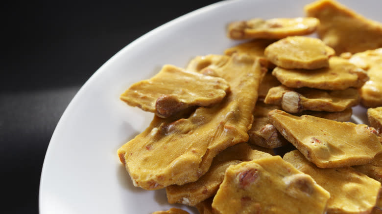 Peanut brittle in white bowl