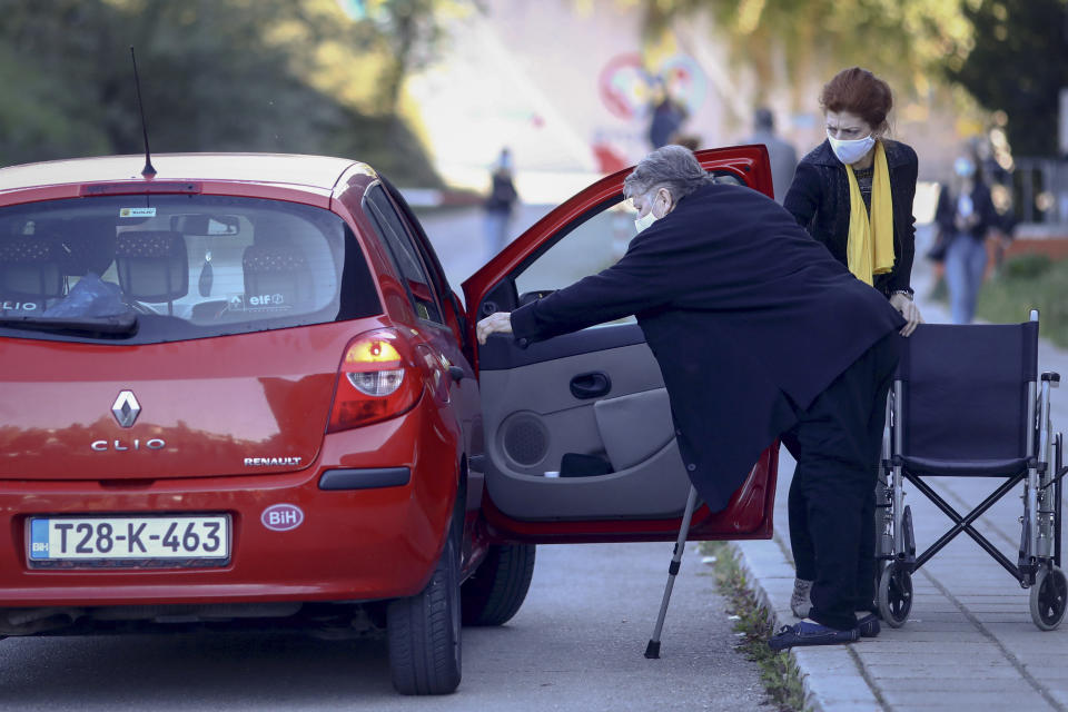 An elderly lady gets into a car after getting a COVID-19 vaccine in Sarajevo, Bosnia, Saturday, Sept. 25, 2021. Public mistrust of authorities in corruption-plagued Bosnia has created an opening for anti-vaccination movement even though the Balkan nation has the highest rate in Europe of coronavirus deaths and faces a growing number of new infections. So far, despite an abundance of coronavirus vaccines in Bosnia, just under 13 percent of its 3.3 million people had been fully immunized against Covid-19. (AP Photo)