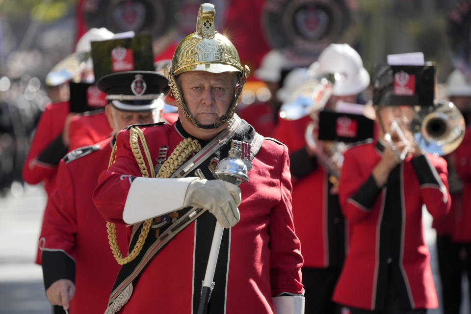 A drum major leads his marching band in the Anzac Day parade in Sydney, Tuesday, April 25, 2023. (AP Photo/Rick Rycroft)