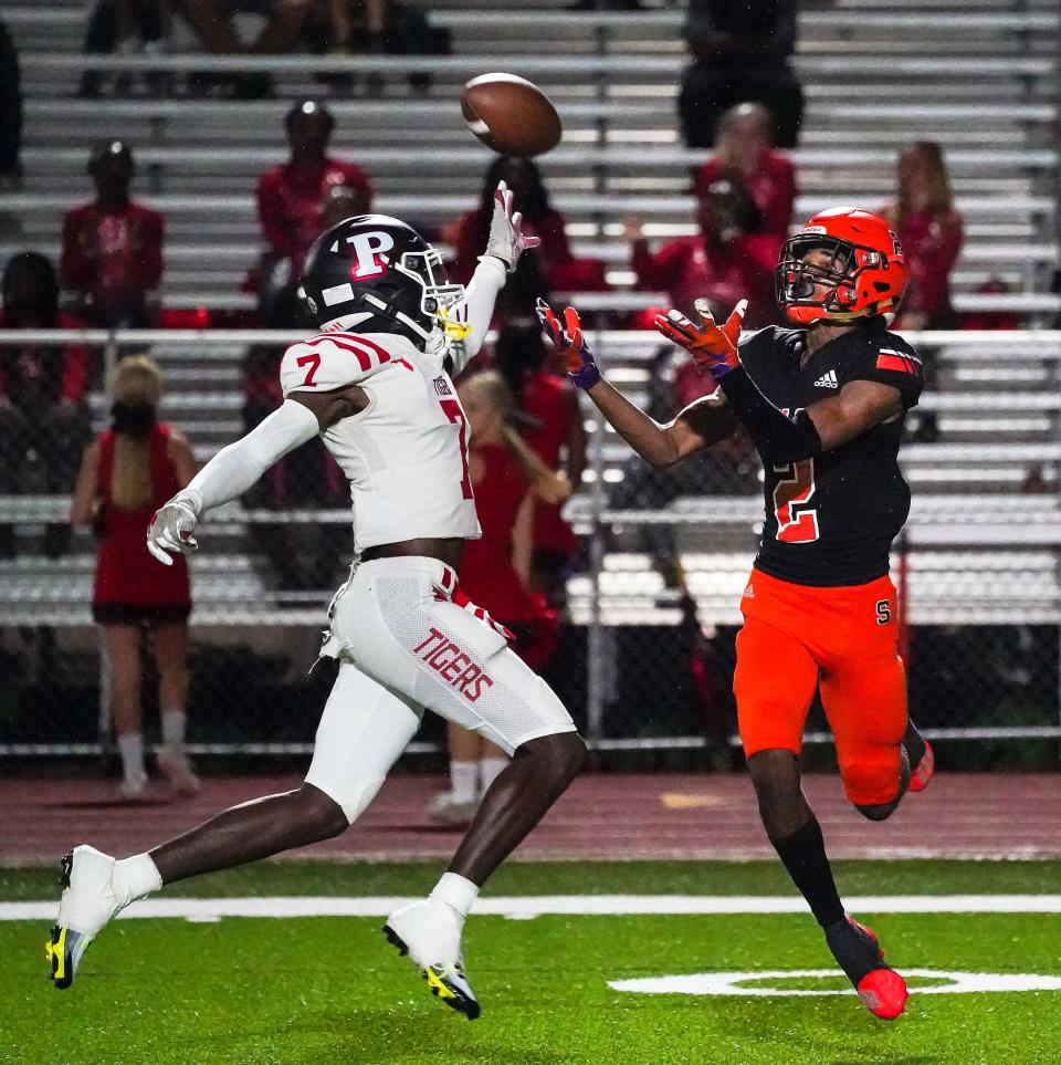 Sarasota's Tyler Pack intercepts a pass intended for Palmetto's Zy'marion Lang during first half action Friday night.