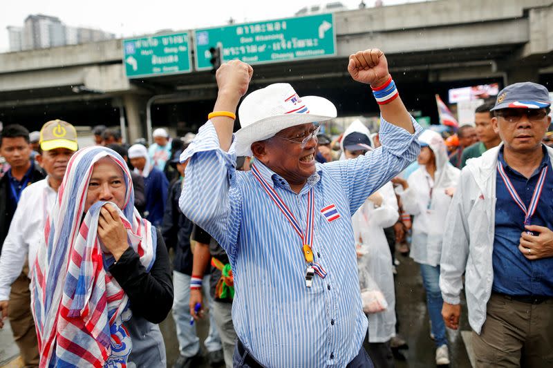 FILE PHOTO: Anti-government protest leader Suthep gestures to his supporters after a Thai court delivered its verdict on PM Yingluck, in Bangkok
