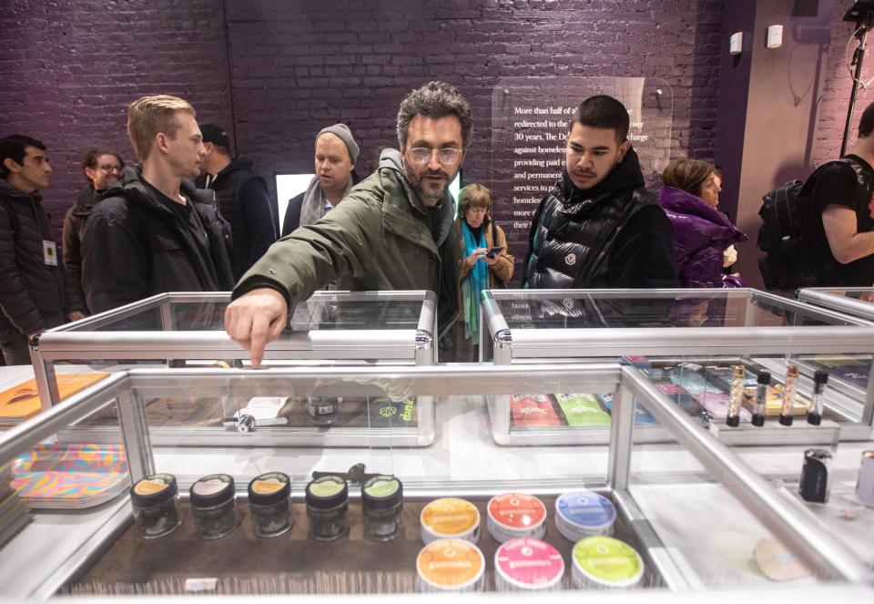 Customers browse products for sale at Union Square Travel Agency: A Cannabis Store located on 13th St. in Manhattan Feb. 13, 2023.