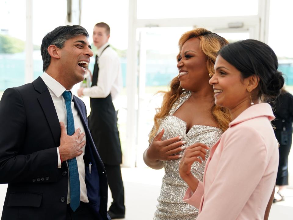 Rishi Sunak and Akshata Murty meet singer Marisha Wallace (Andrew Matthews/PA Wire)