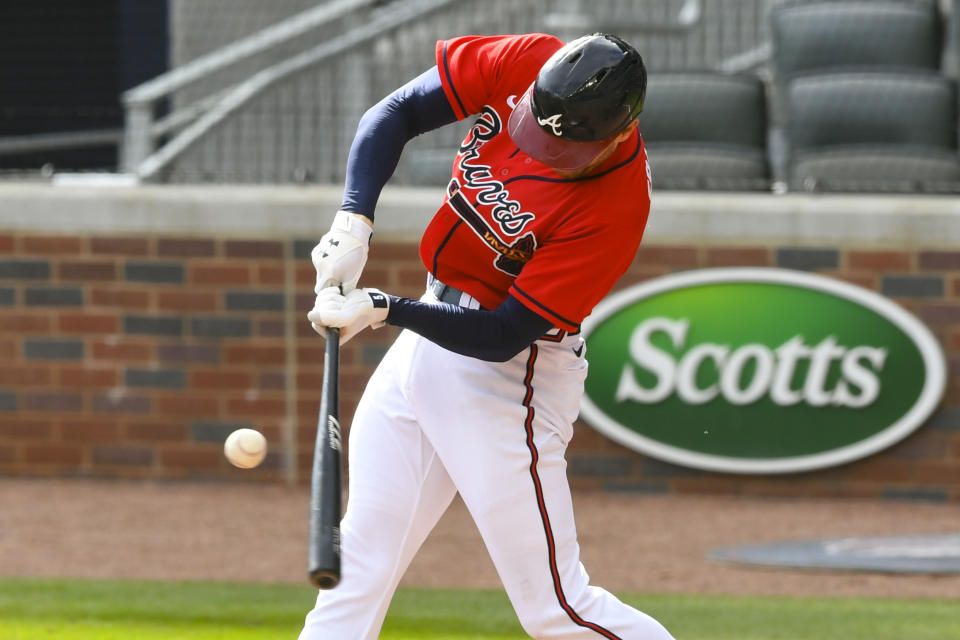Atlanta Braves first baseman Freddie Freeman connects for a line drive single to center field against the Boston Red Sox during the third inning of a baseball game Sunday, Sept. 27, 2020, in Atlanta. (AP Photo/John Amis)