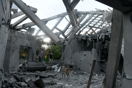 A damaged house that was hit by a rocket can be seen north of Tel Aviv, Israel, March 25, 2019. REUTERS/Yair Sagi