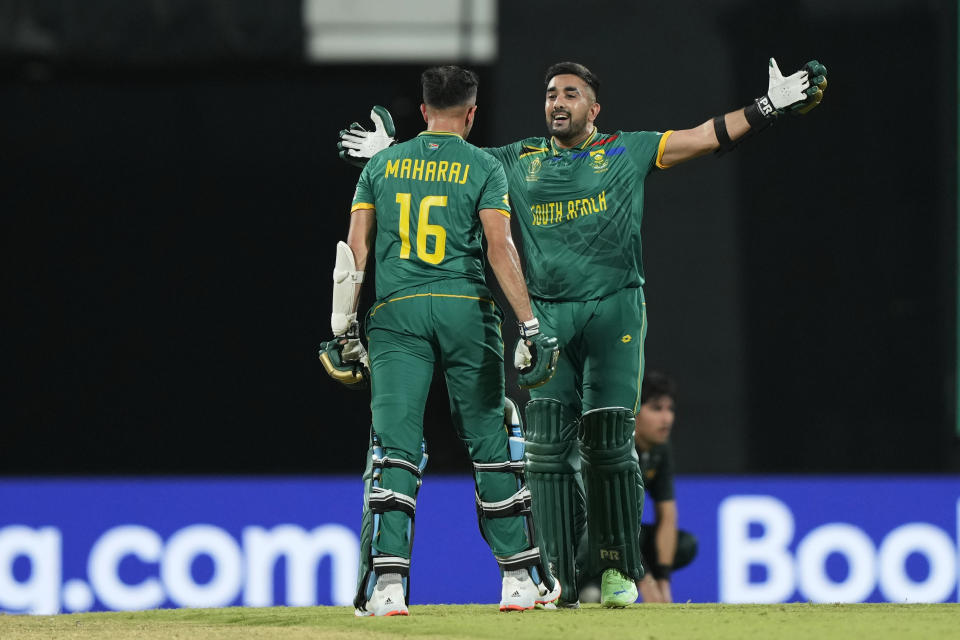 South Africa's Keshav Maharaj, left, and batting partner Tabraiz Shamshi celebrate their win at the end of the ICC Men's Cricket World Cup match between Pakistan and South Africa in Chennai, India, Friday, Oct. 27, 2023. (AP Photo/Mahesh Kumar A.)