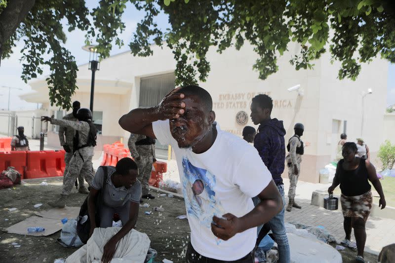 Haitians who were seeking protection from gangs cleared from a camp outside U.S. Embassy