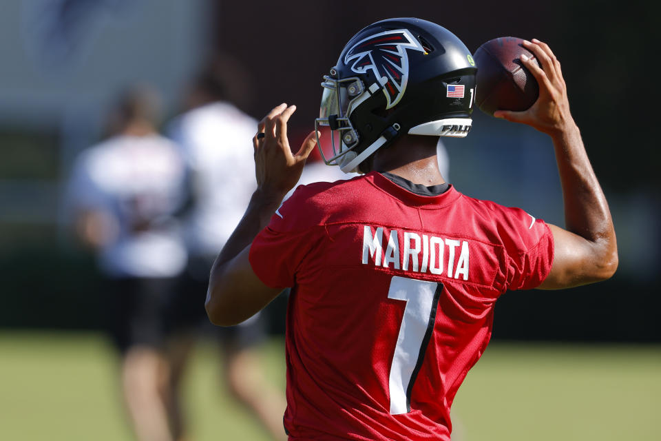 FLOWERY BRANCH, GA - JULY 28: Marcus Mariota #1 of Atlanta Falcons passes during a training camp practice at IBM Performance Field on July 28, 2022 in Flowery Branch, Georgia. (Photo by Todd Kirkland/Getty Images)