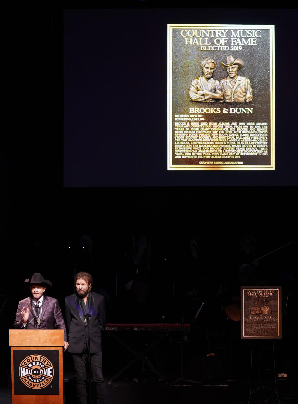 Kix Brooks, left, and Ronnie Dunn, right, speak after being inducted into the Country Music Hall of Fame at 2019 Medallion Ceremony at the Country Music Hall of Fame and Museum on Sunday, Oct. 20, 2019 in Nashville, Tenn. (Photo by Sanford Myers/Invision/AP)