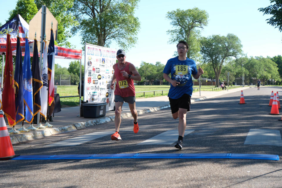 Two runners let out a sigh of relief at the finish of the Chief Petty Officer Jack R. Barnes Run For the Fallen Saturday morning at Stephen F Austin Park in Amarillo.