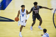 Creighton's Antwann Jones is defended by Omaha's Marlon Ruffin during the first half of an NCAA college basketball game in Omaha, Neb., Tuesday, Dec. 1, 2020. (AP Photo/Kayla Wolf)