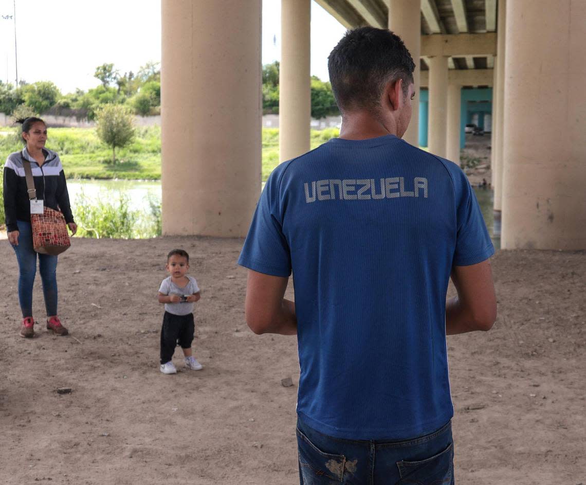 Venezuelan migrants wait for the arrival of U.S. Border Patrol after crossing the Rio Grande.