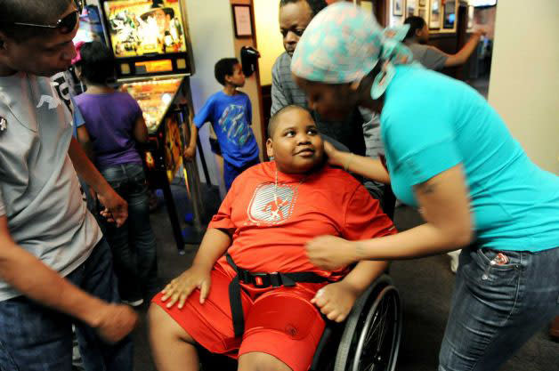 NaSeaph Williams enters his surprise party (Cindy Schultz/Times Union)