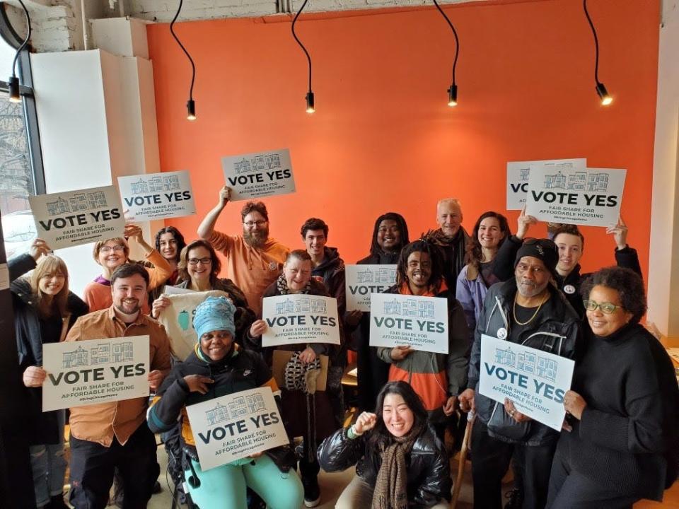 A group of volunteers gathers at the ONE Northside office before a weekend door-to-door canvass in January 2024.