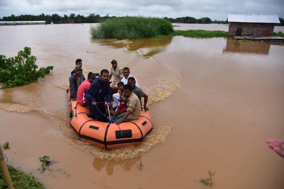 State Disaster Response Force (SDRF) personnel evacuate villagers affected by a flood  at Kachua village in Nagaon district, in the northeastern state of Assam, India,on Sept 26,2020. (Photo by Anuwar Hazarika/NurPhoto)