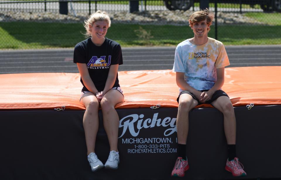 Meadowbrook's senior state qualifiers Camden Black, left, and Ethan Furbee, right, take a break before getting in some practice for this weekend's OHSAA State Track Championships on Tuesday evening at Eugen Capers Field in Byesville.