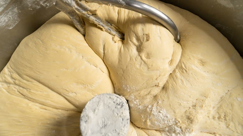 Close-up of whisk in bowl of dough