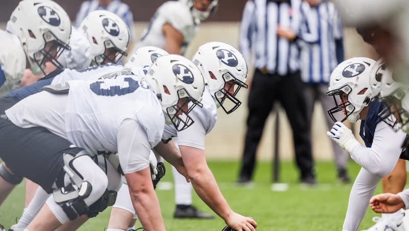 BYU players prepare for a snap during spring drills in Provo on March 14, 2024. Spring camp concluded last Friday.