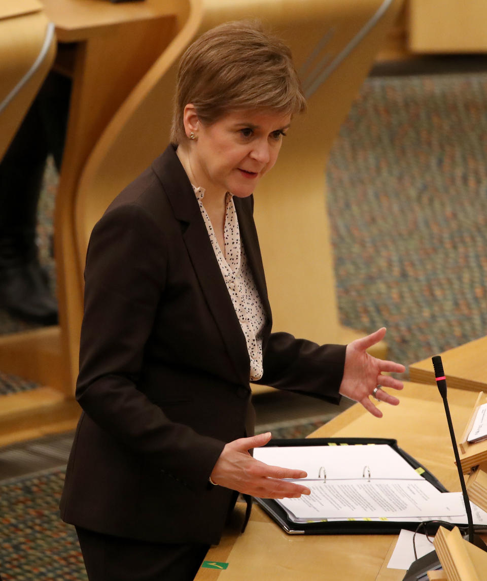 First Minister Nicola Sturgeon reacts as she delivers a statement at Holyrood, Edinburgh, announcing that Scotland will be placed in lockdown from midnight for the duration of January with a legal requirement to stay at home except for essential purposes.