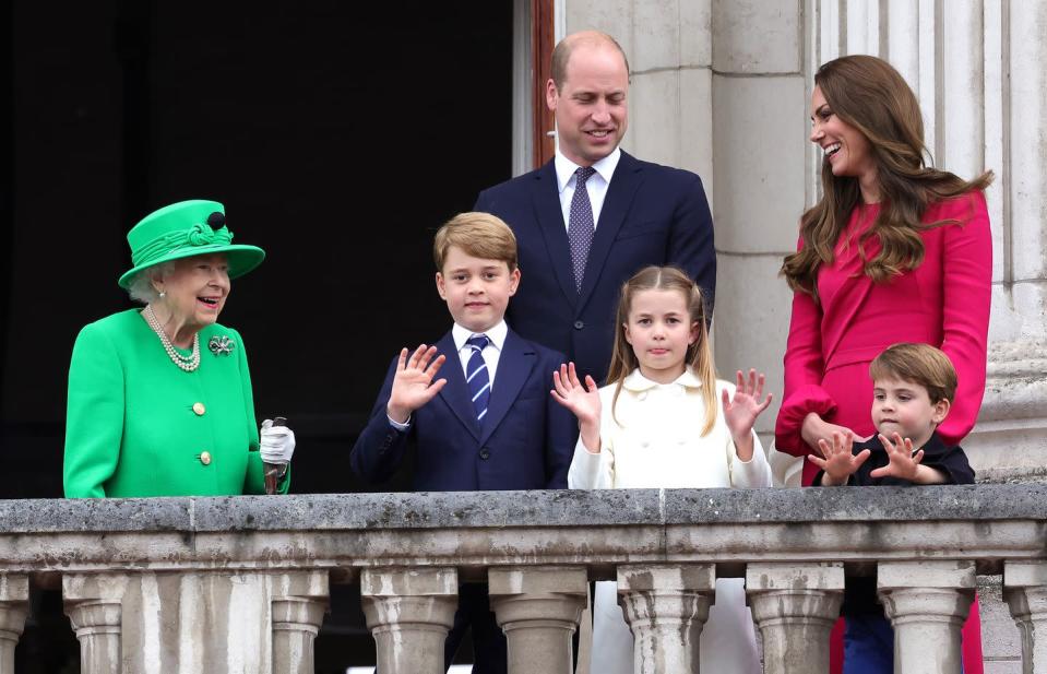 <p>The Queen looks on with a huge smile as three of her great-grandchildren wave to onlookers, standing on the balcony of Buckingham Palace during the Platinum Jubilee Pageant. </p>