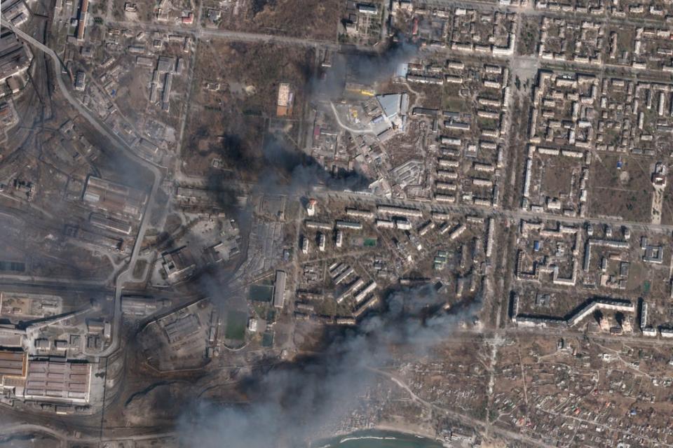 In this satellite photo, buildings burn after Russian strikes on a district of Mariupol (Planet Labs PBC via AP)