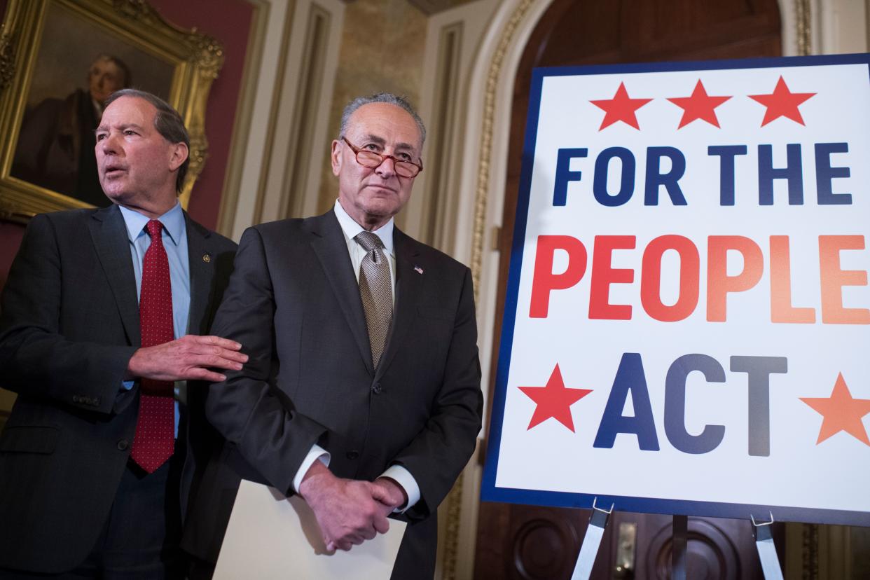 Then-Senate Minority Leader Charles Schumer (center) and then-Sen. Tom Udall (D-N.M.) attend a news conference about the For the People Act on March 27, 2019, in the U.S. Capitol. (Photo: Tom Williams/CQ Roll Call/Getty Images)