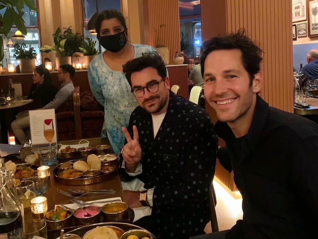 The photo of Asma Khan with Dan Levy and Paul Rudd in her restaurant, Darjeeling Express, that went viral in September 2021 (Asma Khan)