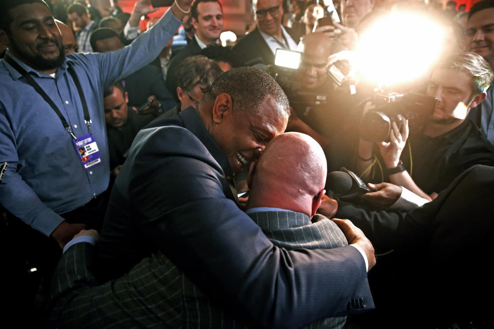 David Griffin, New Orleans Pelicans Executive Vice President of Basketball Operations, gets a hug from head coach Alvin Gentry after it was announced that their team had won the first pick during the NBA basketball draft lottery Tuesday, May 14, 2019, in Chicago. (AP Photo/Nuccio DiNuzzo)