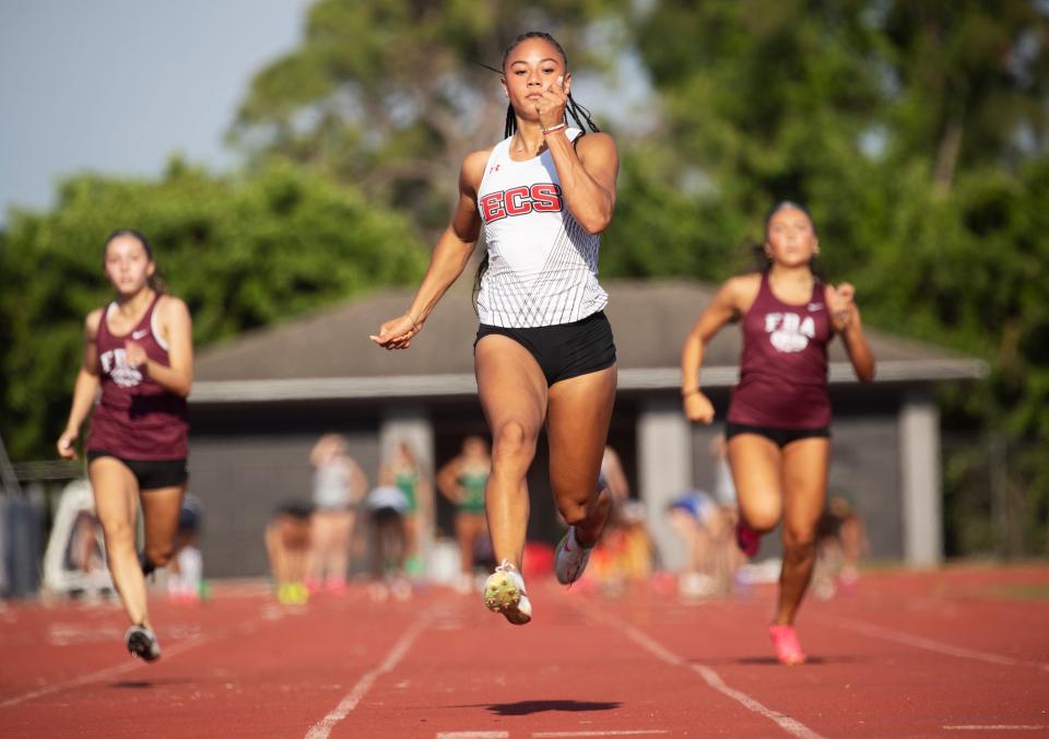 McKenzie Travis from Evangelical Christian School wins the girls 100 during the Private 8 track and field meet at Evangelical School on Friday, April 19, 2024.